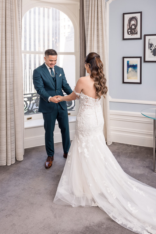 groom checking out his bride at the first look