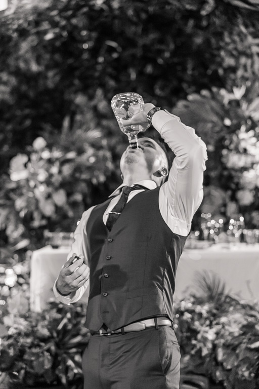 groom drinking straight from the bottle