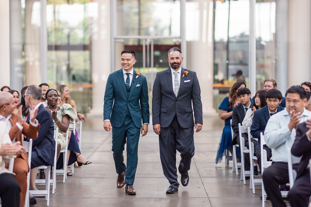 groom walking down the aisle with his best man