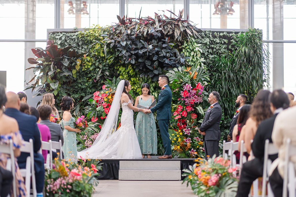 Cal Academy wedding ceremony at the living wall in the Piazza