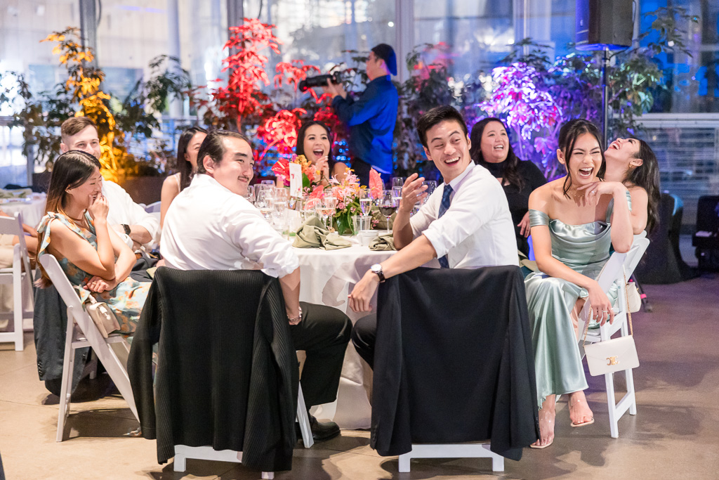 guests laughing at a funny speech