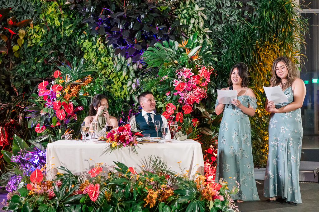 sister and bridesmaid giving dinner toast