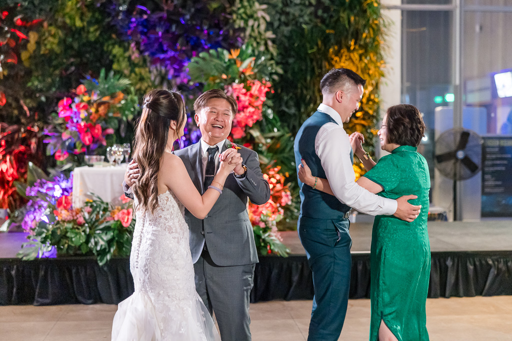 combined parent dances with groom + mom and bride + dad