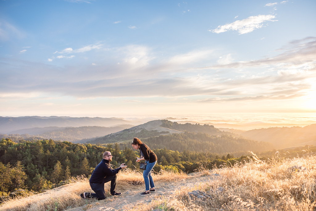golden hour hiking trail surprise proposal with a sea of fog in the distance