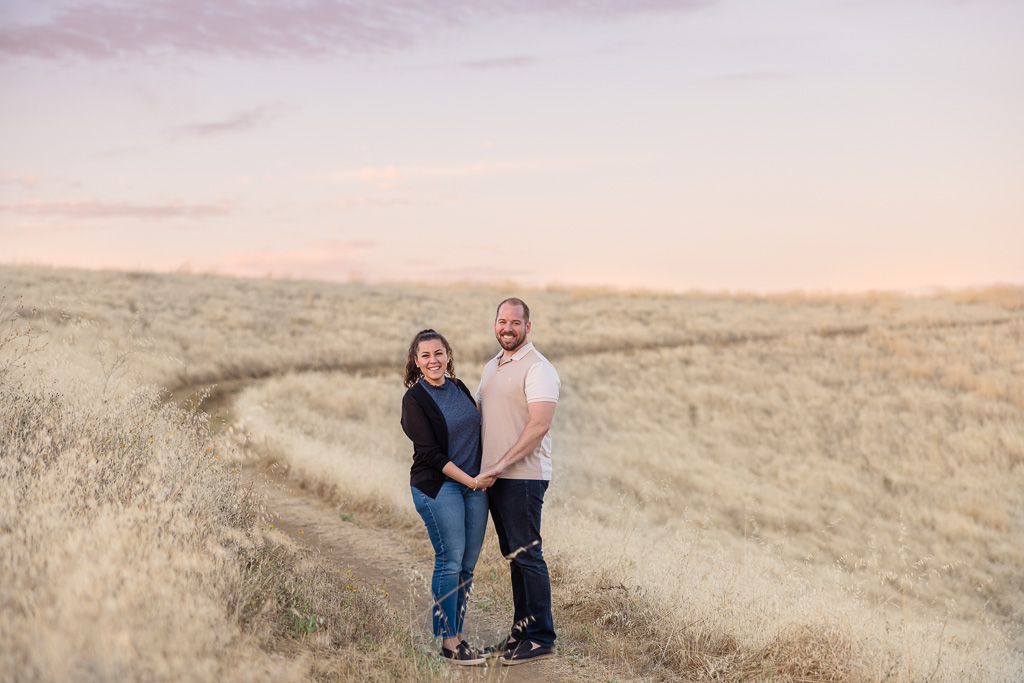 photo of couple with pastel skies