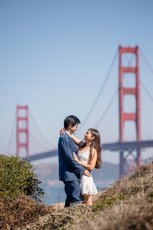 a unique angle of an engagement photo at the Golden Gate Bridge