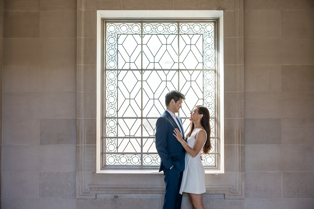 portrait of a couple at a square window
