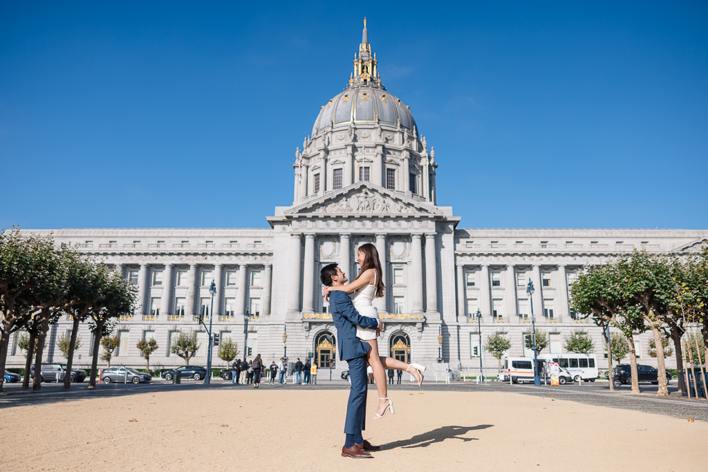 sunny midday engagement photos in front of SF City Hall