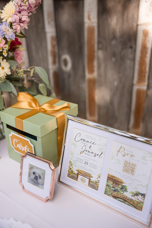 welcome table with gift box and framed invitation set