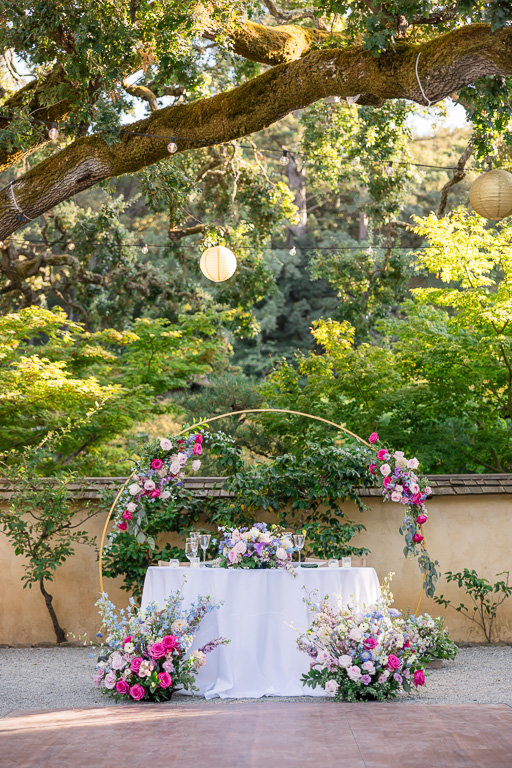 Hakone Gardens head table with wedding arch decorated with flowers