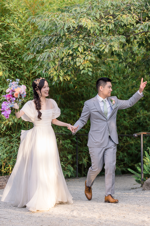 bride and groom entering the reception
