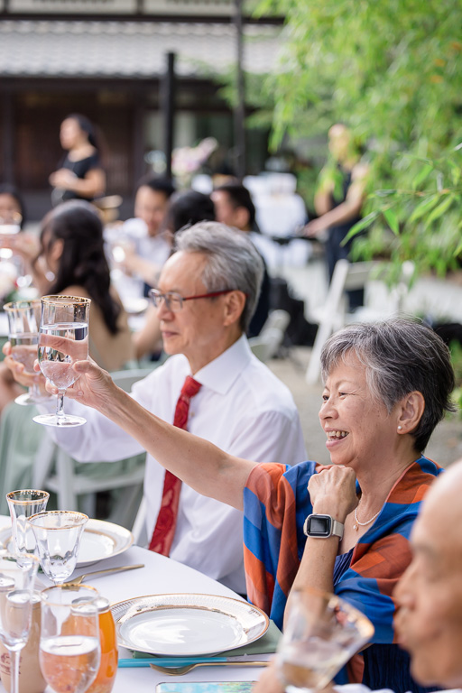 guests toasting to the newlyweds