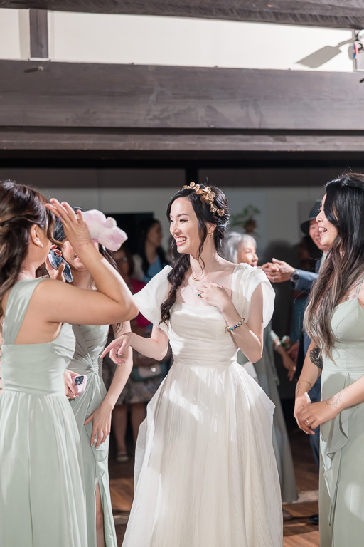 bride dancing with her bridesmaids