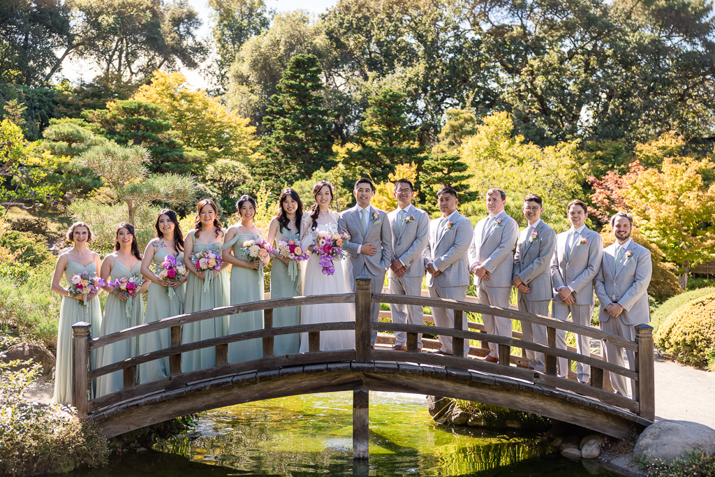 bridal party photo on a wooden bridge
