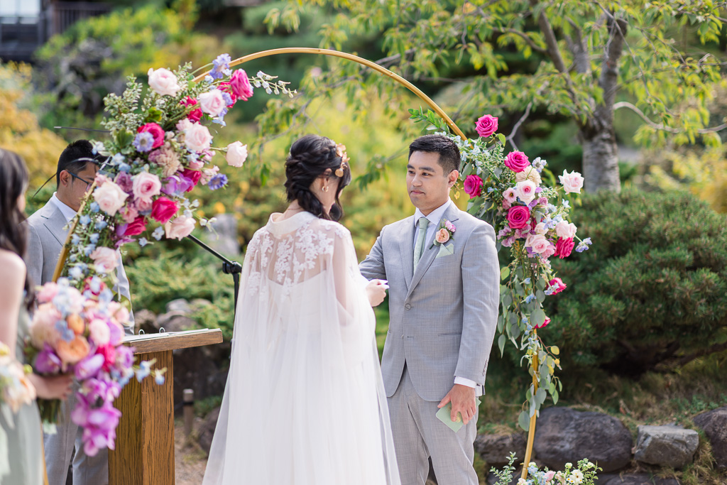 groom looking at the bride during ceremony vows