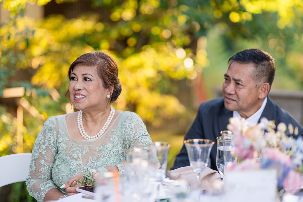 groom’s parents at the reception table
