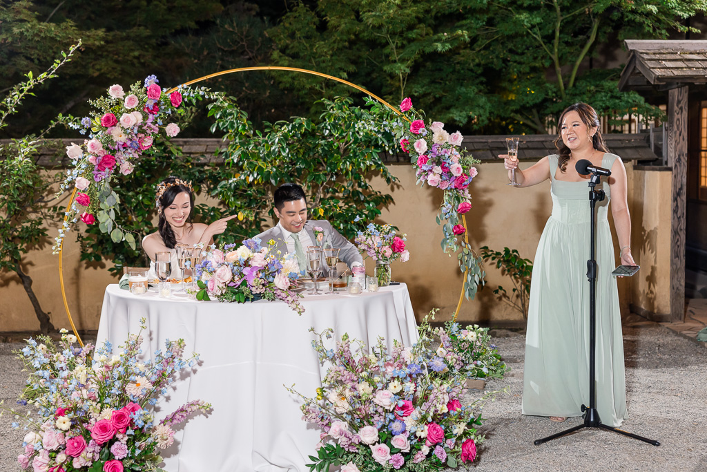 nighttime dinner toast by bridesmaid