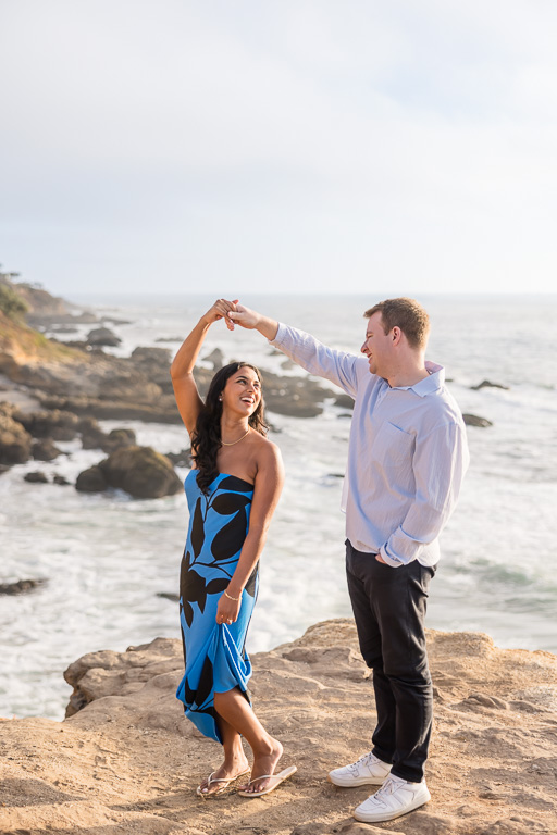 dancing above the rocks on an ocean bluff