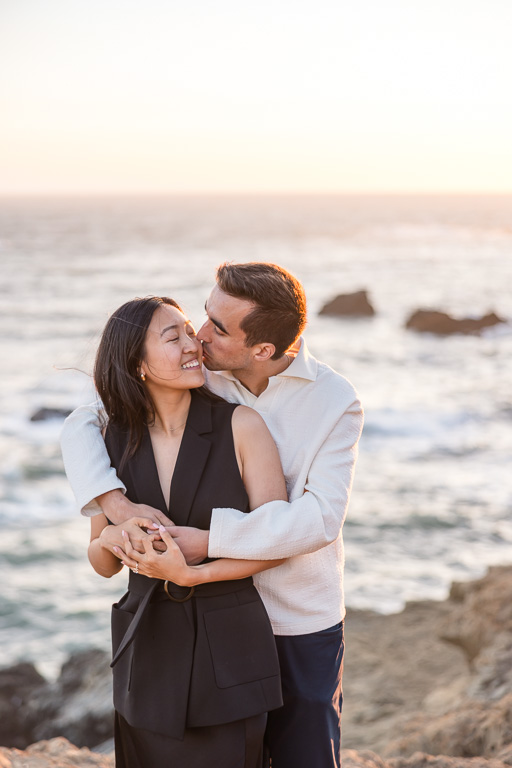 a cute intimate close-up portrait of newly engaged couple
