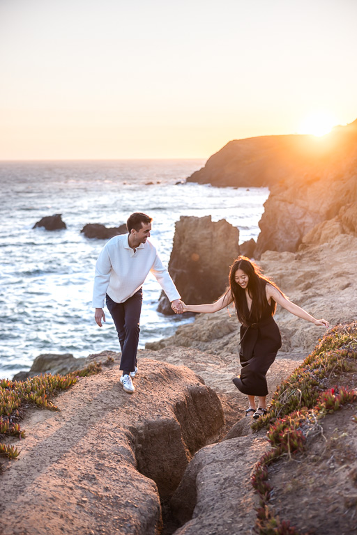 walking along the rocks at sunset over Rodeo Beach