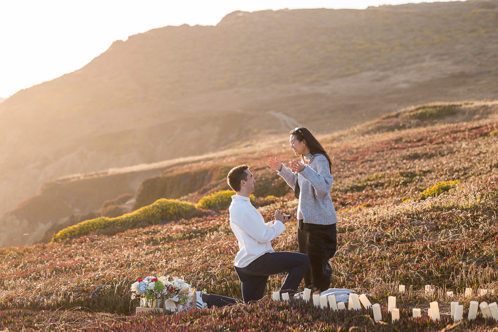 colorful sunset proposal at the Rodeo Beach cliffs