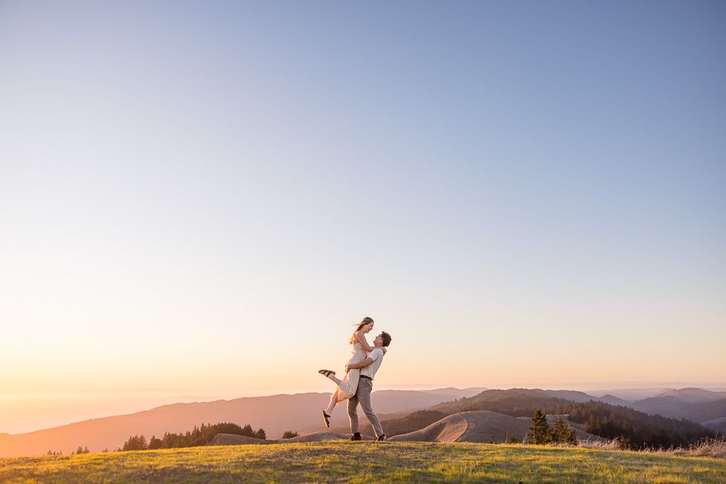 epic engagement photos on a mountain top at sunset