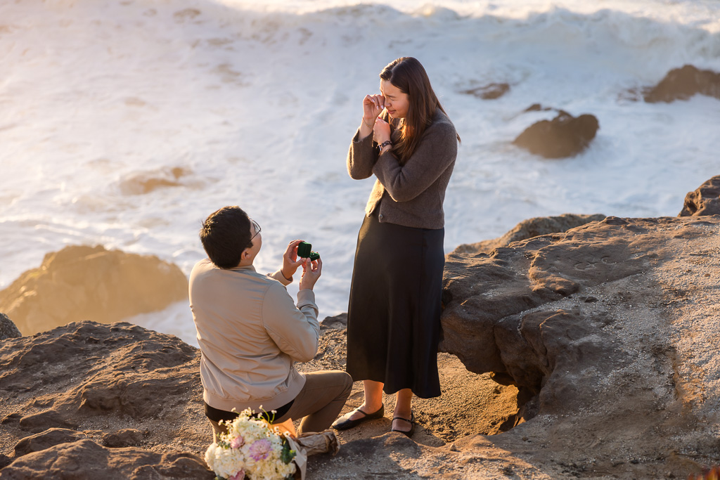 rubbing away a tear during an emotional marriage proposal