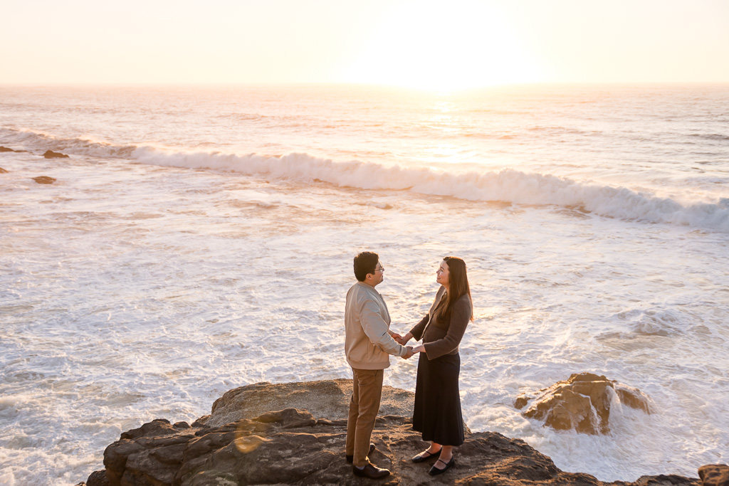 engagement photos just before sunset above a sea of white ocean water