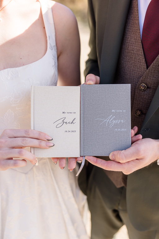 Alyssa and Zach’s customized vow books with names monogrammed on the front