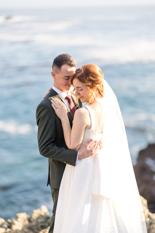 sun-lit wedding photo by the Pacific Ocean