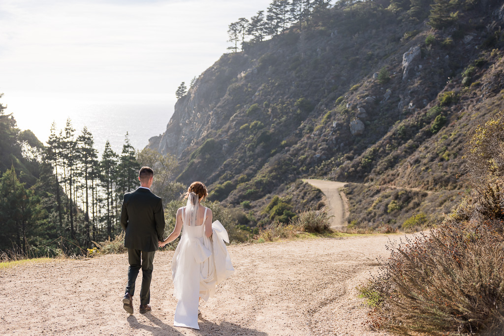 candid moment between bride and groom on a hiking trail in Big Sur