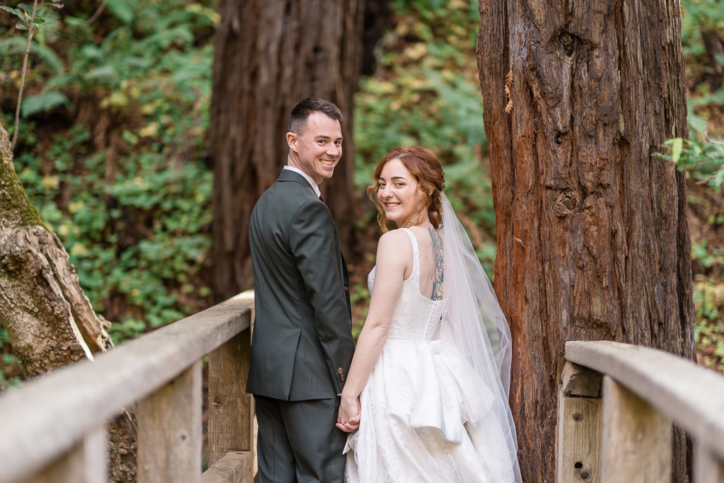 couple walking along wooden bridge in Big Sur