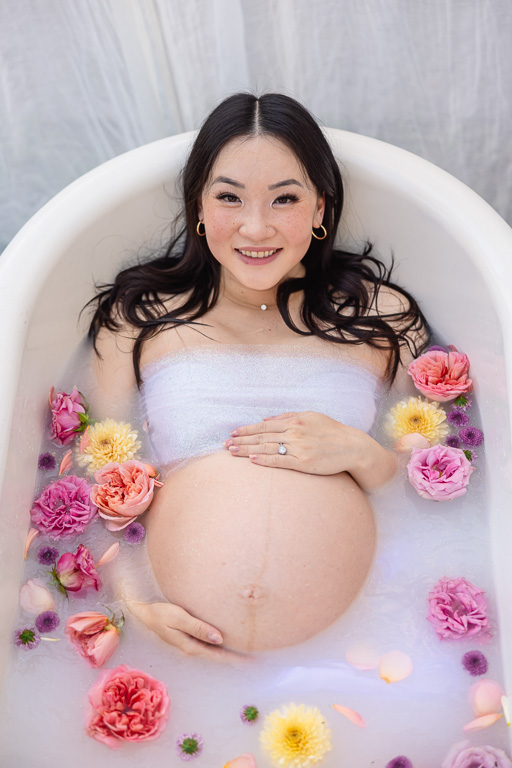 maternity photos in a bathtub with milk