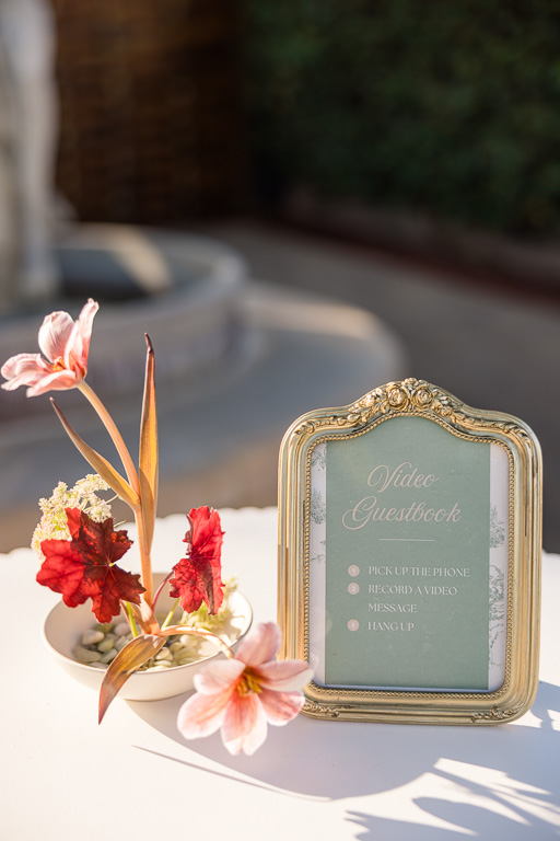 sign-in table decor sign and flower