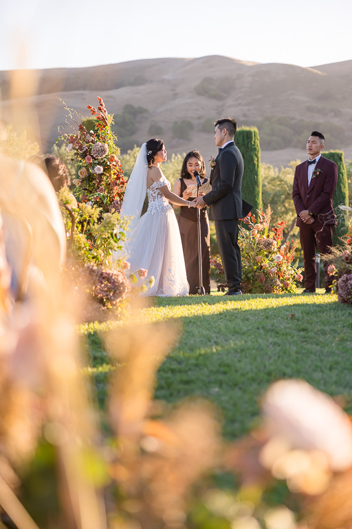 bride and groom standing together at the ceremony