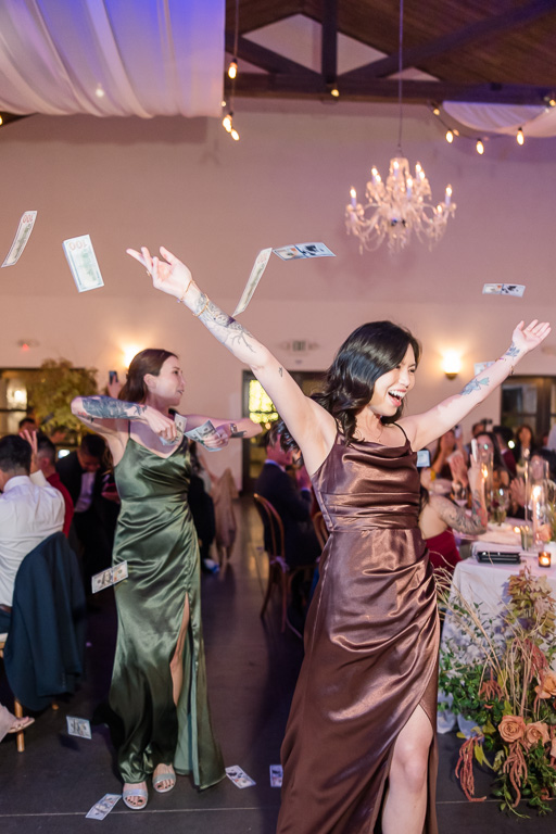 bridesmaid wedding entrance throwing stacks of cash