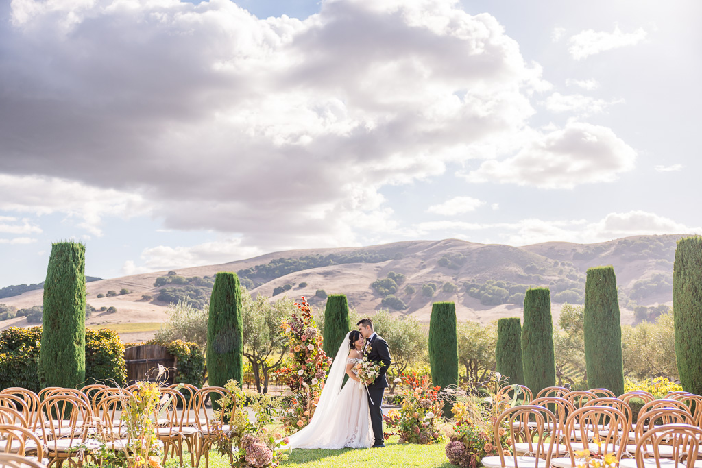 wedding photo of couple at Viansa Sonoma's ceremony area in fall sunlight