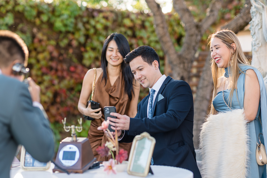 a friend taking a cell phone photo