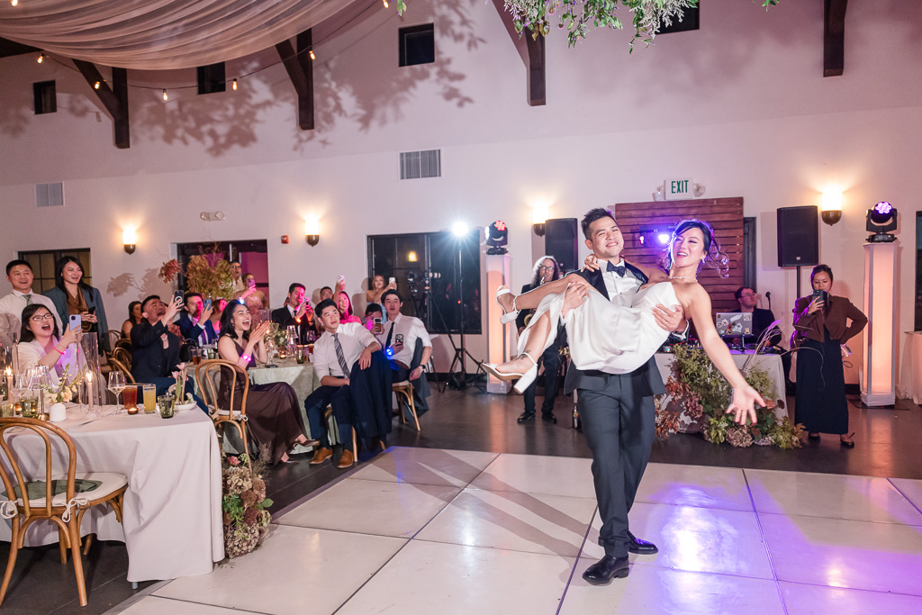 the bride being carried at the end of the first dance
