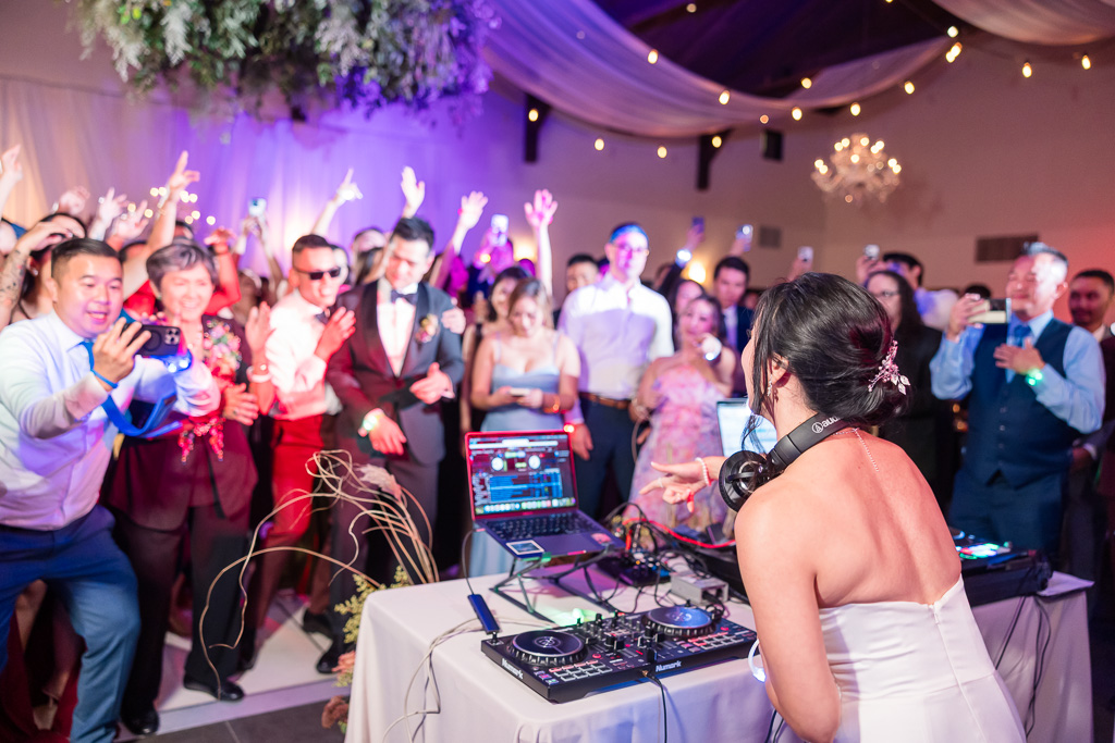 the bride taking over as the DJ for a few songs