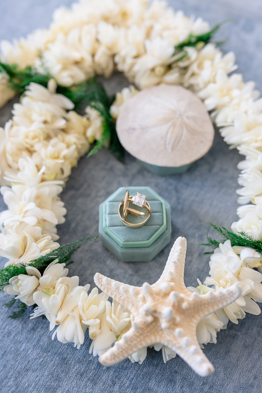 wedding ring with lei and seashells