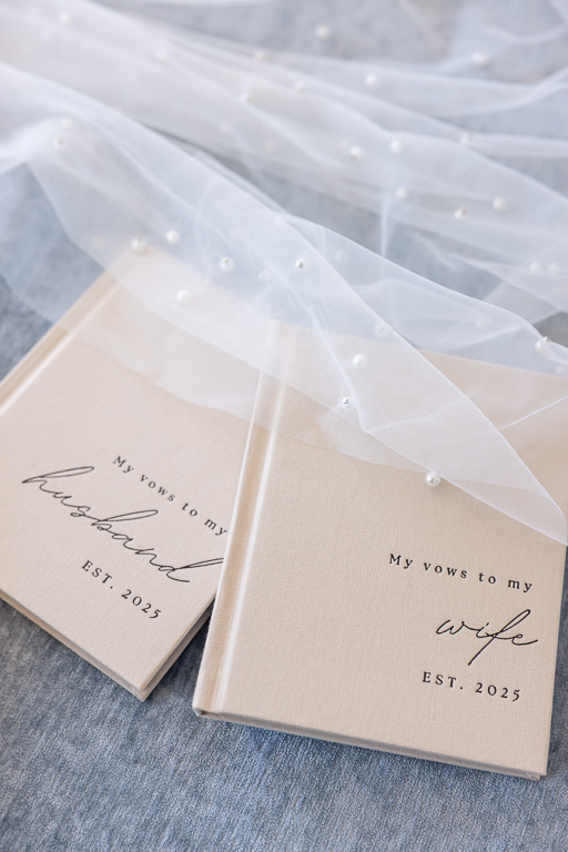 vow books and bridal veil elegantly displayed