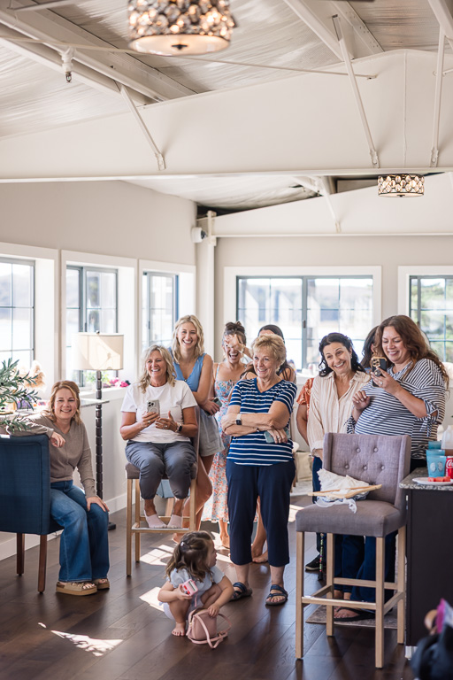 all the ladies looking on while the bride has her first look with dad