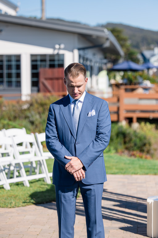 groom looking anxious to see his bride