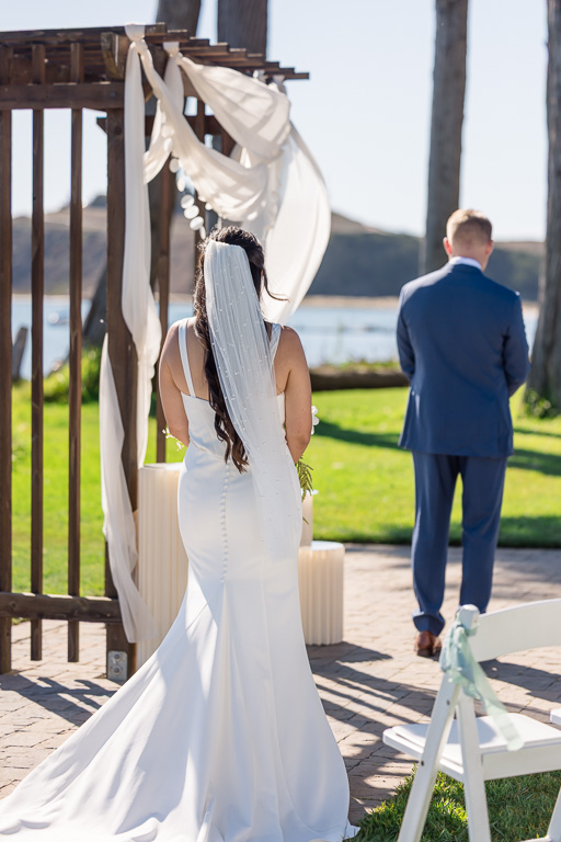 bride walking up to the groom for first look
