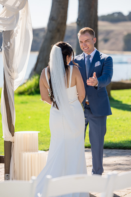 groom admiring his bride during the first look