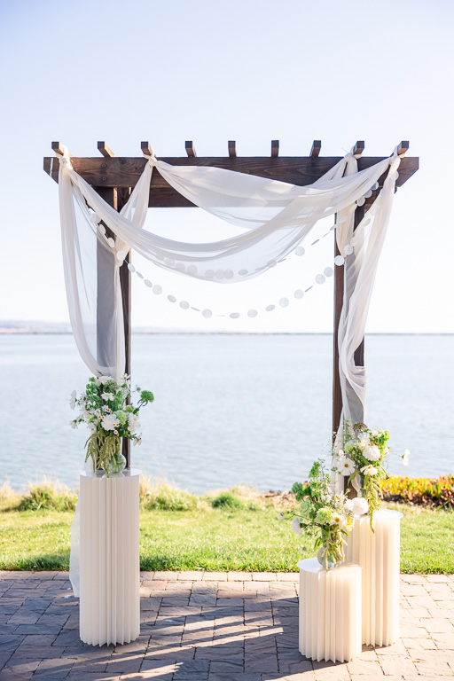 Mavericks House wedding arbor with DIY florals and decor