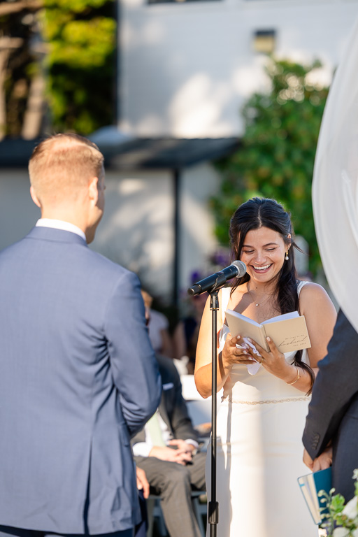 happy bride smiling as she gives her vows