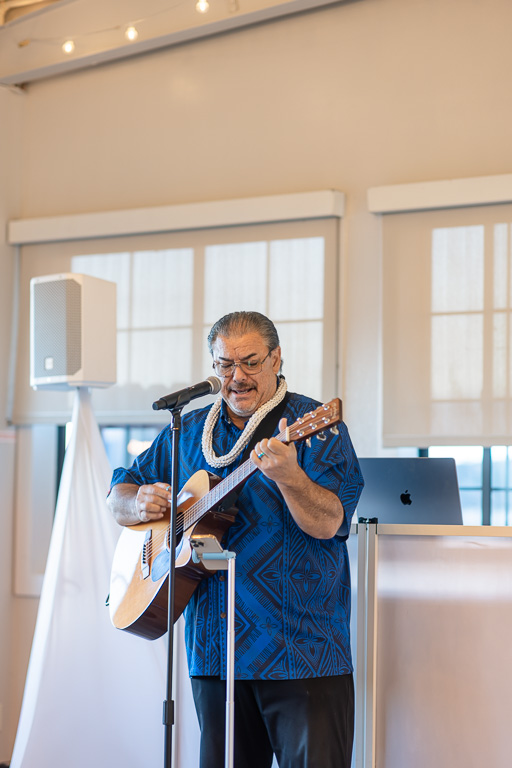 uncle playing banjo at wedding reception