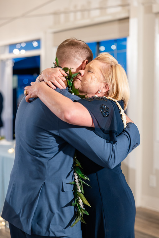 mom hugging the groom